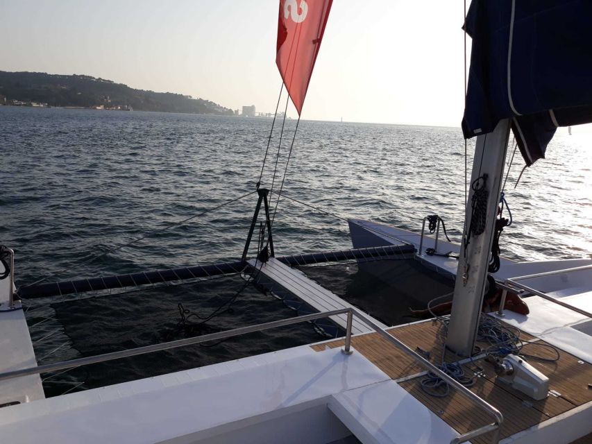 Lisbon: Private Catamaran Charter for up to 18-People - Toward Lisbon and beneath the 25th of April Bridge