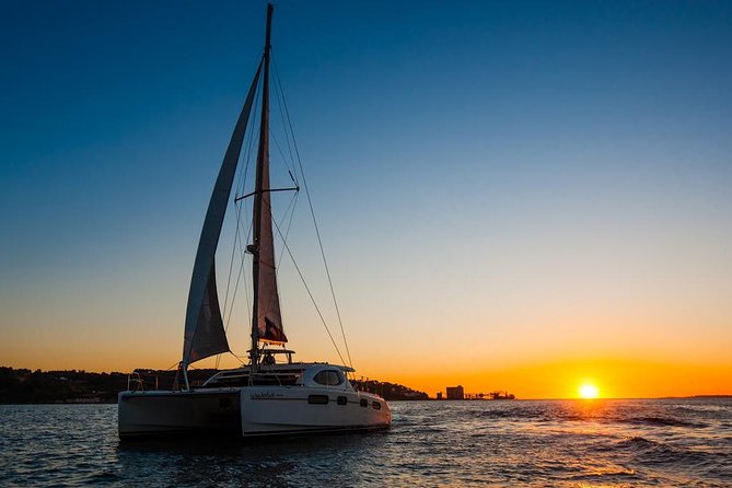 Lisbon: Sunset Cruise With Drinks on Spacious Yacht - Setting out beneath the 25 de Abril Bridge