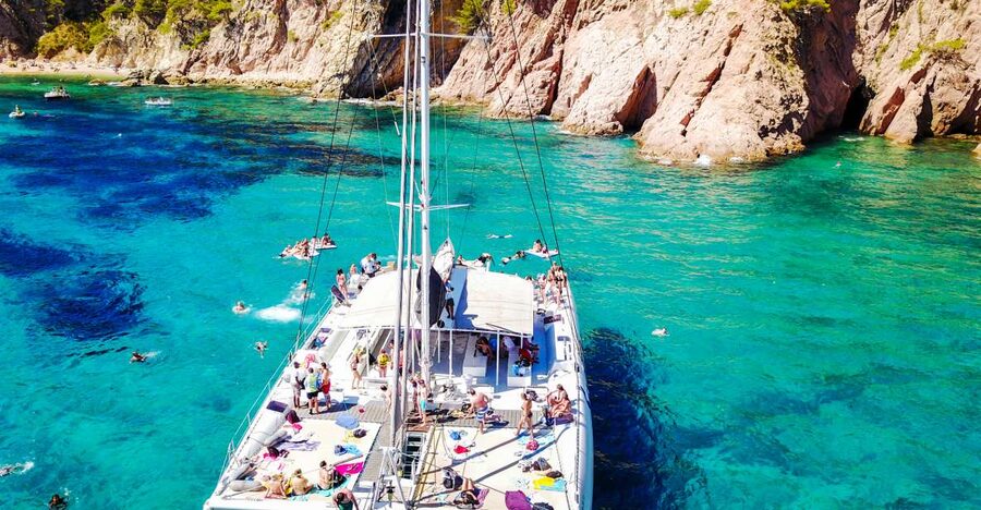 Lloret de Mar: Catamaran Sailing Cruise with BBQ and Drinks - Sailing out from Lloret’s sandy waterfront