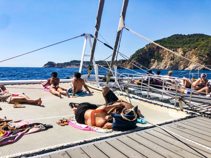 Lloret de Mar: Catamaran Sailing Cruise with BBQ and Drinks - An hour of Costa Brava scenery before the swim stop