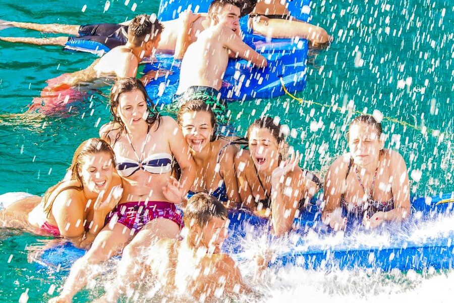 Lloret de Mar: Catamaran Sailing Cruise with BBQ and Drinks - The return trip turns into a floating party