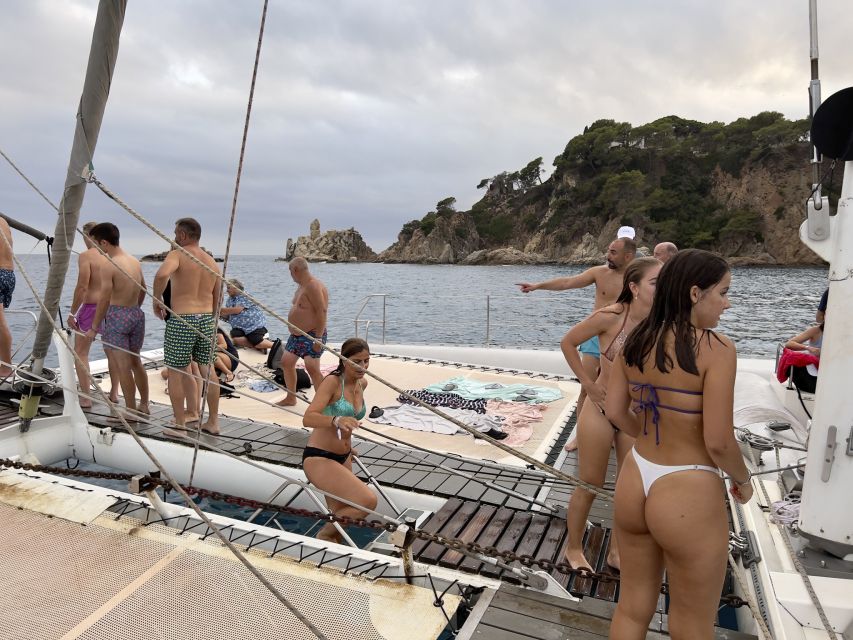 Lloret de Mar: Sunset Catamaran Cruise with DJ and Drinks - A sunset cruise built around music and swimming