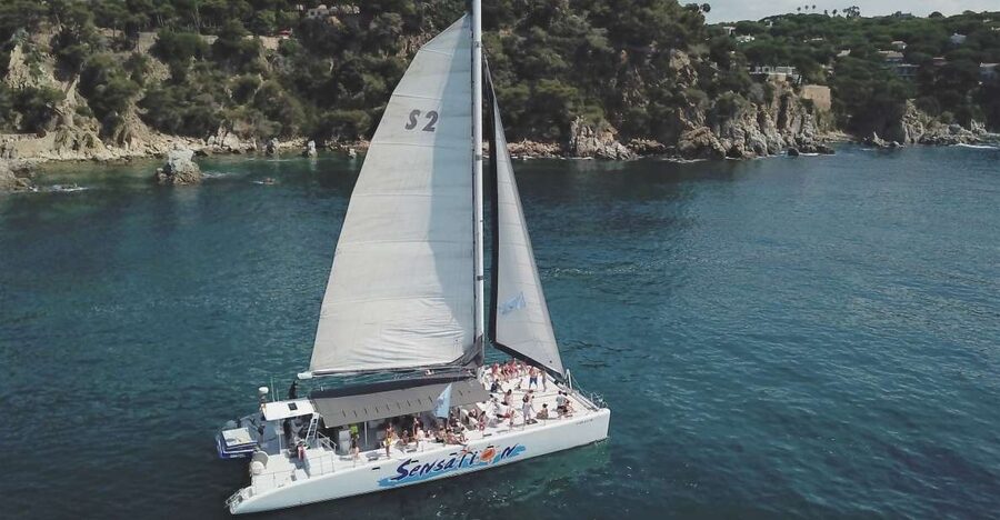 Lloret de Mar: Sunset Catamaran Cruise with DJ and Drinks - Following the Costa Brava shore for two hours
