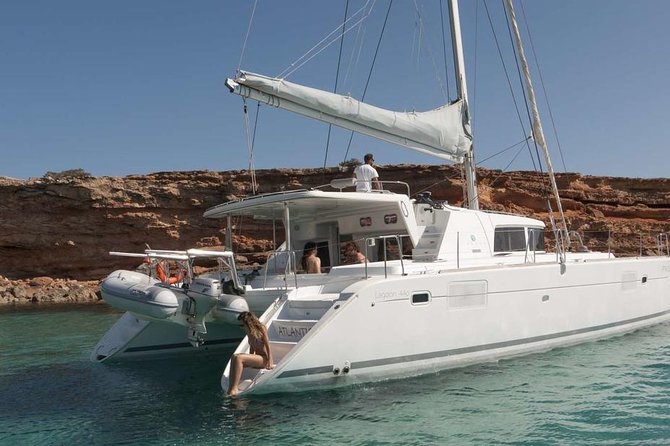 Luxury Catamaran Semi private cruise with meals & drinks and transportation. - Passing Baos and ancient Delos