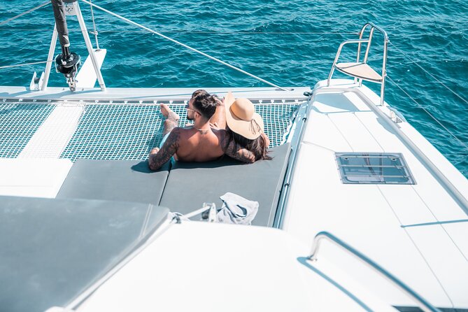 Majestic Catamaran Caldera Cruise with Snacks, Meal & Drinks - White Beach, snorkeling, and the caldera cliffs