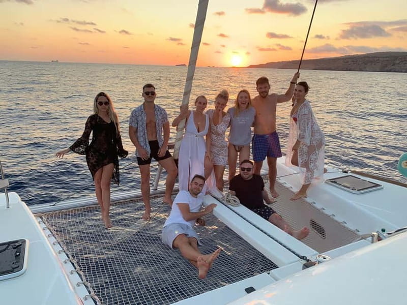 Majorca: Dinner aboard a private catamaran with snorkeling and paddle surfing - Seafood dinner as the sun goes down