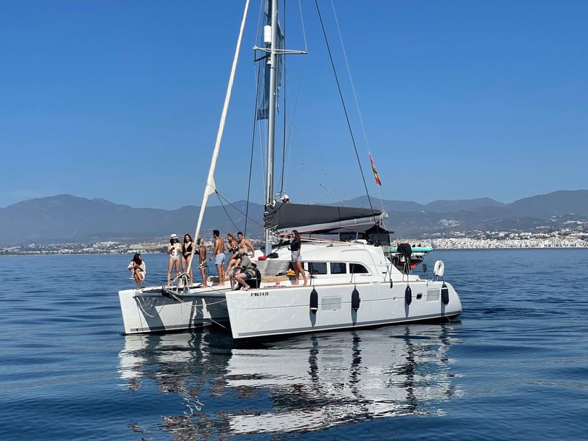 Marbella: Group Dolphin Watching Catamaran Tour with Snacks - Watching for dolphins along Marbella’s coast