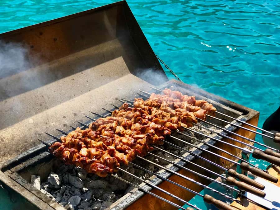 Mauritius: Ile Aux Cerfs Catamaran Trip w/ Lunch & Transfer - BBQ lunch, local drinks, and the family touch
