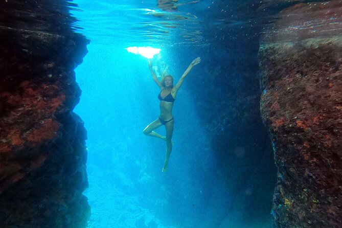 Milos caves snorkelling Catamaran Cruise in a small group - Sikia: a cave reached by dinghy