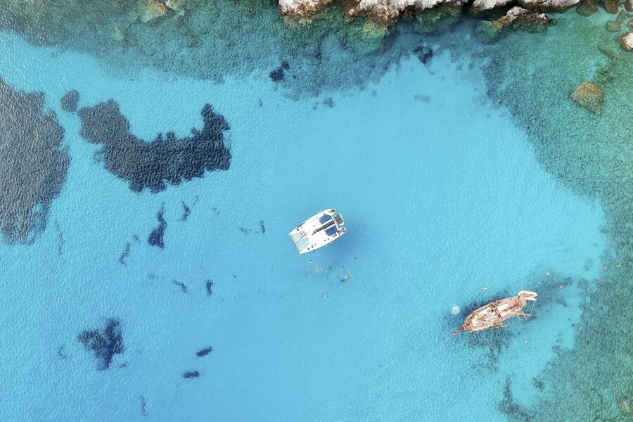 Milos: Full-Day Catamaran Cruise with Paddle Board - A Quiet Final Swim at Saint Dimitrios