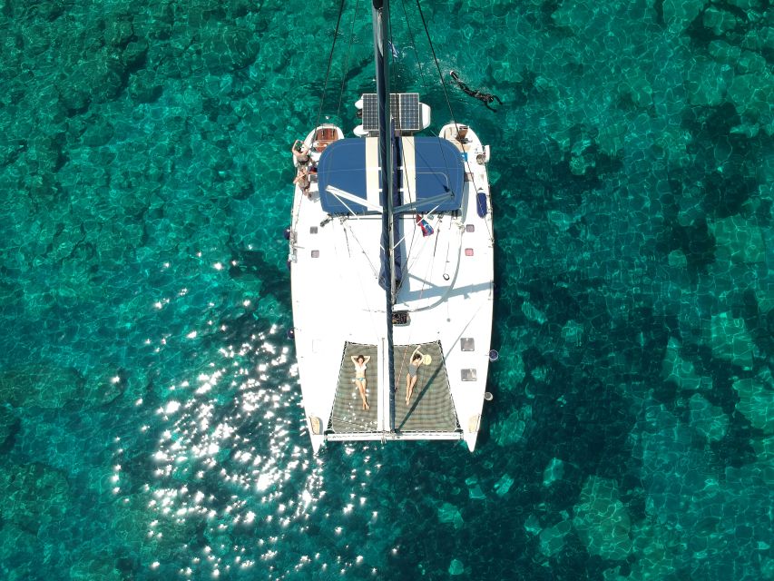 Milos: Full-Day Catamaran Cruise with Paddle Board - Kalogries Bay Starts the Swimming