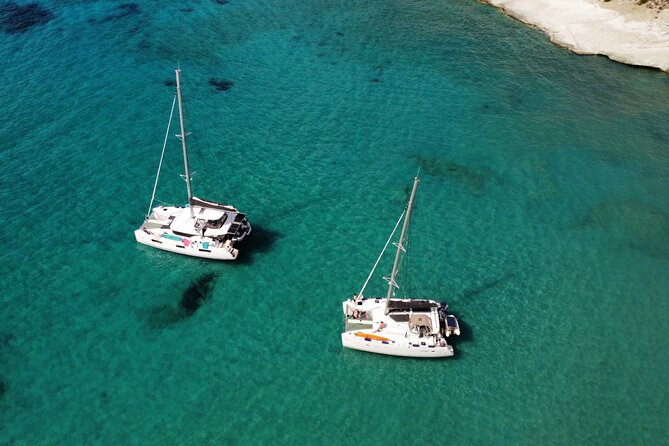 Milos & Poliegos Catamaran Cruise Homemade Full menu BBQ & Drinks - Gerakas Beach, hot spring water, and Greek BBQ