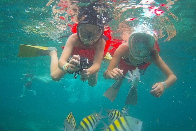 Montego Bay Catamaran: Snorkel Tour with Open Bar & Reggae DJ - Dancing, foot massages, and the trip back