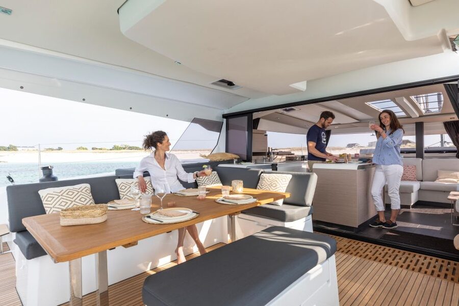 Mykonos: Catamaran Cruise with 3-Course Meal and Transfers - Pickup, tender boats, and the start of the day