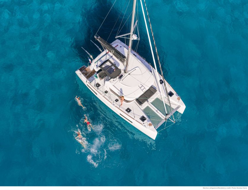 Mykonos: Catamaran Cruise with Lunch, Drinks and Transfer - Leaving Mykonos with a small group
