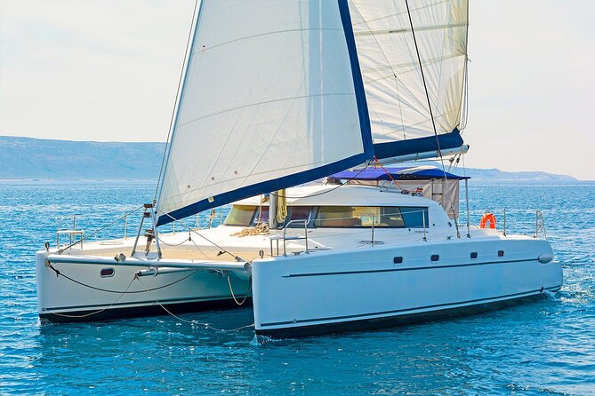 Mykonos Catamaran Delos Rhenia Cruise with Lunch and Transfer - Rhenia’s Quiet Beaches and Clear Water