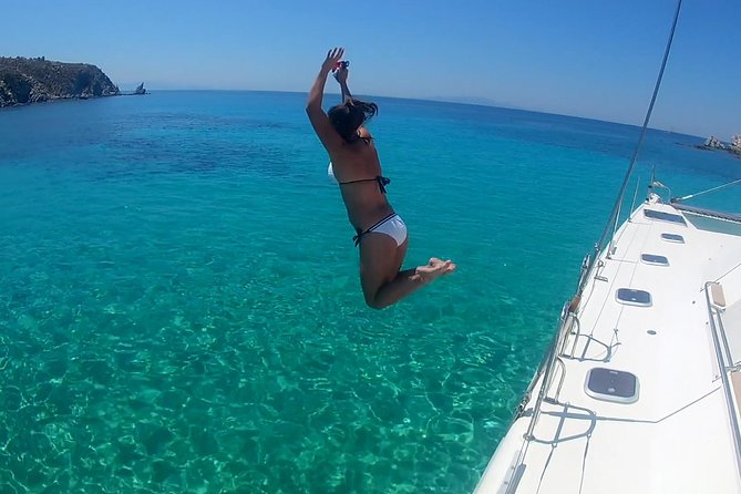 Mykonos Catamaran Private Sunset Cruise, Full Meal & Open-Bar - Rhenia swimming and snorkeling stop