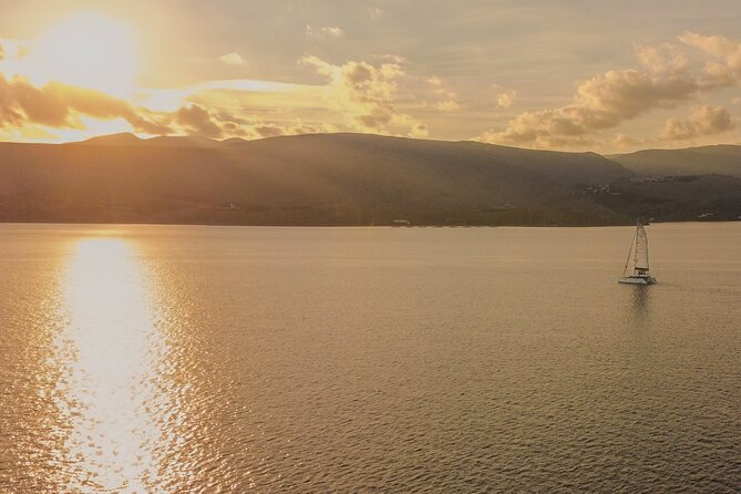 Mykonos Catamaran Sunset Cruise with Meal, Drinks & Transfer - What the crew adds to the evening
