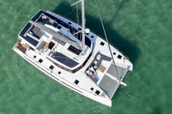 Mykonos: Luxury Catamaran Cruise with Meal, Drinks & Transport - Leaving Agia Anna and getting onto the boat