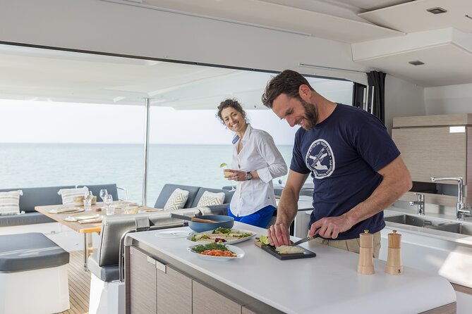 Mykonos: Luxury Catamaran Cruise with Meal, Drinks & Transport - What the crew and boat experience add