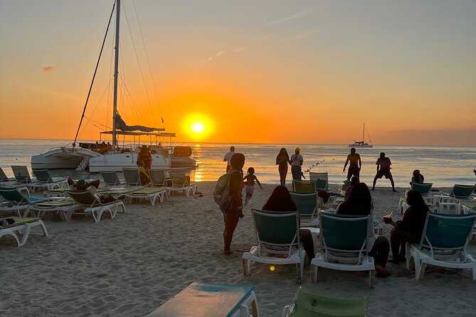 Negril Private Day Tour: ATV Ride, Party Catamaran & Ricks Cafe - Seven Mile Beach and the move to the catamaran