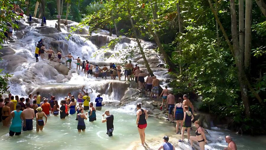Ocho Rios Catamaran: Dunn's River, Snorkeling & Open Bar - Climbing Dunn’s River Falls with a local guide