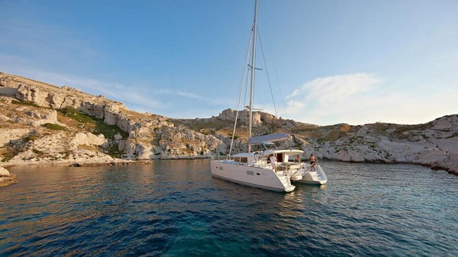 Olbia: catamaran tour in the Tavolara Marine Protected Area - Cala Moresca and Capo Ceraso swimming stops