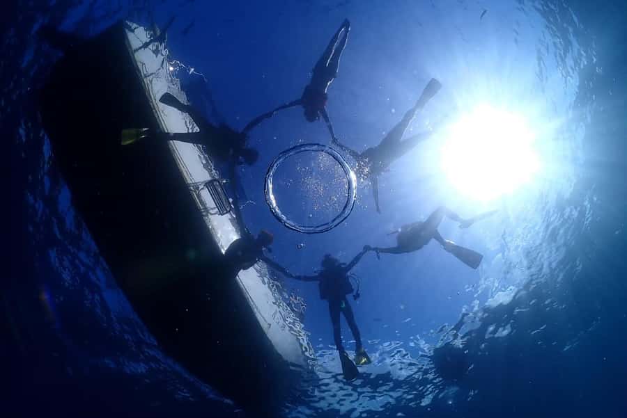 Onna: Blue Cave Snorkeling from Catamaran - From the shop to the catamaran