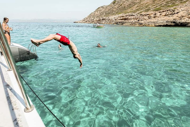Palma de Mallorca: Half-Day Catamaran Tour with Buffet Meal - The ride back, Palma sights, and the sunset choice