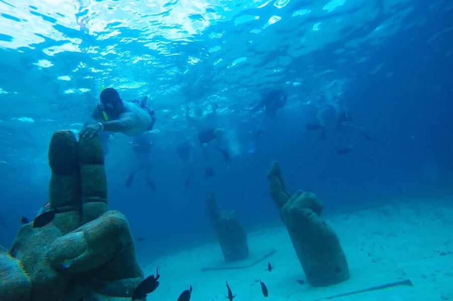 PDC: Isla Mujeres Catamaran Tour with Snorkeling - Sunset music and the return ride