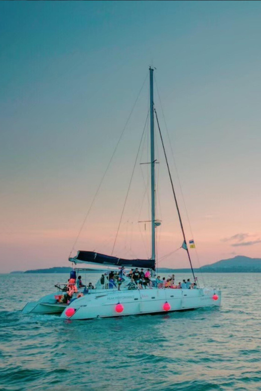 Phuket: Coral Island Catamaran Cruise with Sunset Dinner - Guides, crew, and the feel onboard