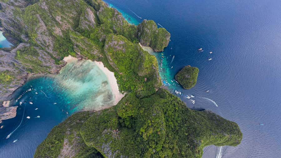 Phuket: Phi Phi Khai or Maiton Island by Speedboat/Catamaran - Khai Island: white sand, swimming, and a busy beach stop