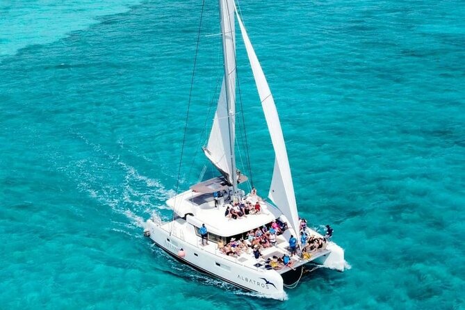 Plus Full Day Catamaran Tour to Isla Mujeres All Inclusive - The crew, music, and group atmosphere