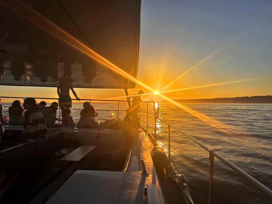 Portimao: SUNSET Benagil Caves Tour | Eco Catamaran - Following the Algarve cliffs toward Benagil