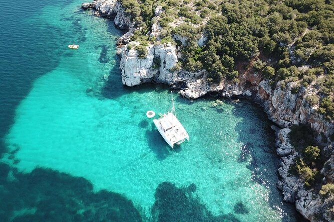 Porto Conte: Half-day catamaran tour with aperitif - Leaving Marina di Porto Conte