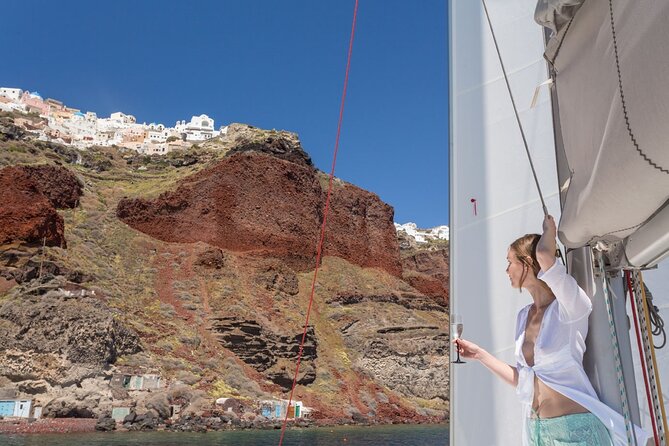 Premium Small-Group Catamaran Cruise with BBQ, Open Bar, Transfer - Pickup at Vlychada and the first look at the coast
