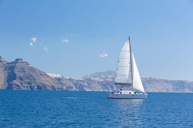 Premium Small-Group Catamaran Cruise with BBQ, Open Bar, Transfer - Nea Kameni, Thirasia, and the caldera from sea level