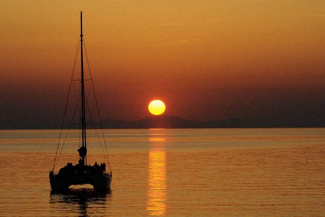 Premium Small-Group Catamaran Cruise with BBQ, Open Bar, Transfer - Red Beach, White Beach, and Mesa Pigadia