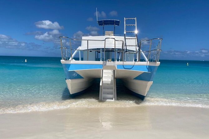Private 7-Hour Catamaran Tour in Turks and Caicos - Half Moon Bay, beach BBQ, and the second-deck slide