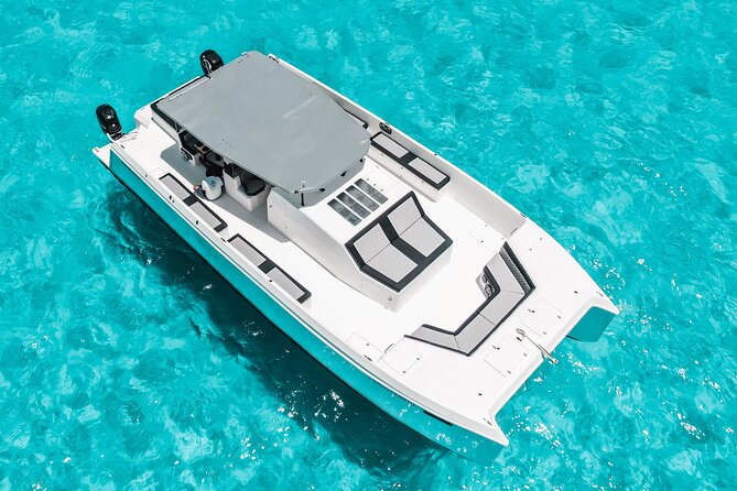 Private Atomic Catamaran Tour to Isla Mujeres - Snorkeling time and what to bring