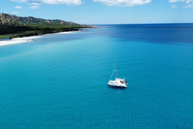 Private catamaran sailing trip around La Caletta -Berchida - Sardinia - Santa Lucia adds variety to the route