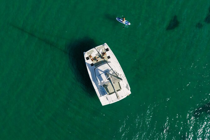 Private Catamaran Tour Lagos Coast and Ponta da Piedade - The Calm Bay Stop: Swimming, Snorkeling, and Paddleboards