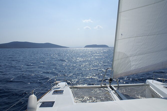 Private Catamaran Tour: Lisbon coast cruise with barbecue and drinks - Passing under the bridge and into Lisbon’s waterfront