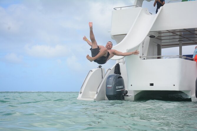 Private Catamaran with Sound system, Slide, Open bar & Snorkeling - Cruising Bávaro Beach with your own music