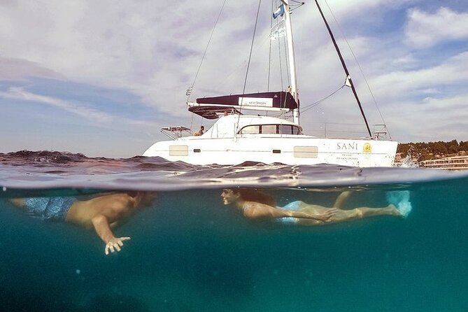 Private Full Day Cruise in Corfu on Lagoon Catamaran - Agni Beach pairs lunch with a small harbor