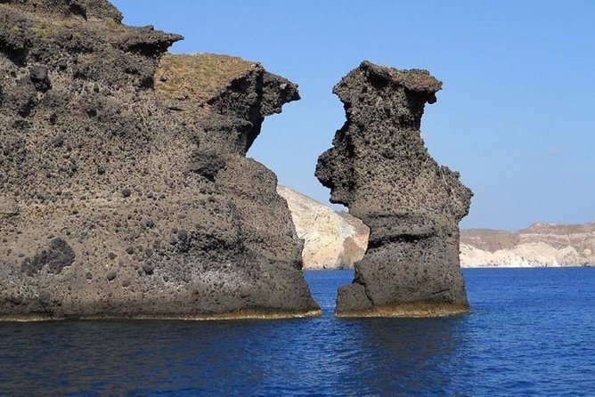 Private Luxury Santorini Catamaran Cruise with Port Pickup - White Beach and Indian Rock from the water