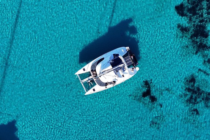 Private Mykonos Catamaran Day Cruise with Meals & Water Toys - Stop one: Ornos and the open-water views