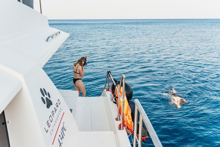 Rhodes: Sunset Catamaran Cruise with Dinner Buffet & Drinks - The sunset return toward Rhodes Town