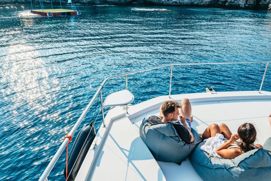 Rhodes: Sunset Catamaran Cruise with Dinner Buffet & Drinks - Leaving Mandraki Harbor for the east coast