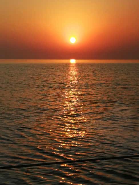 Rhodes: Sunset Catamaran Cruise with Snack, Fruits & Drinks - Fruit, drinks, and the practical value of the fare